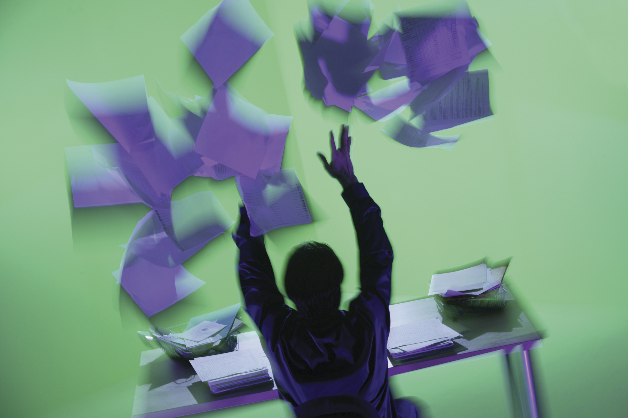 Frustrated Businessman Throwing Papers in the Air